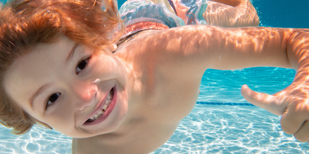 Boy Smiling Underwater Boy Smiling Underwater