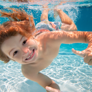 Boy Smiling Underwater