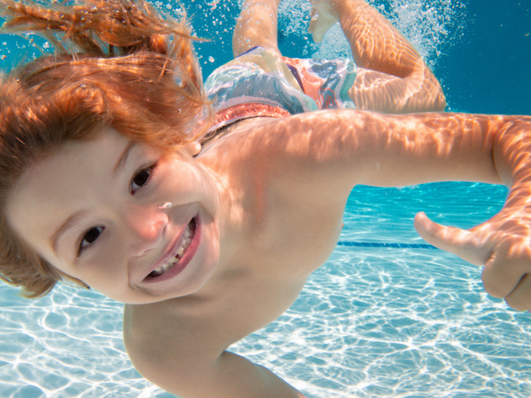 Boy Smiling Underwater Boy Smiling Underwater